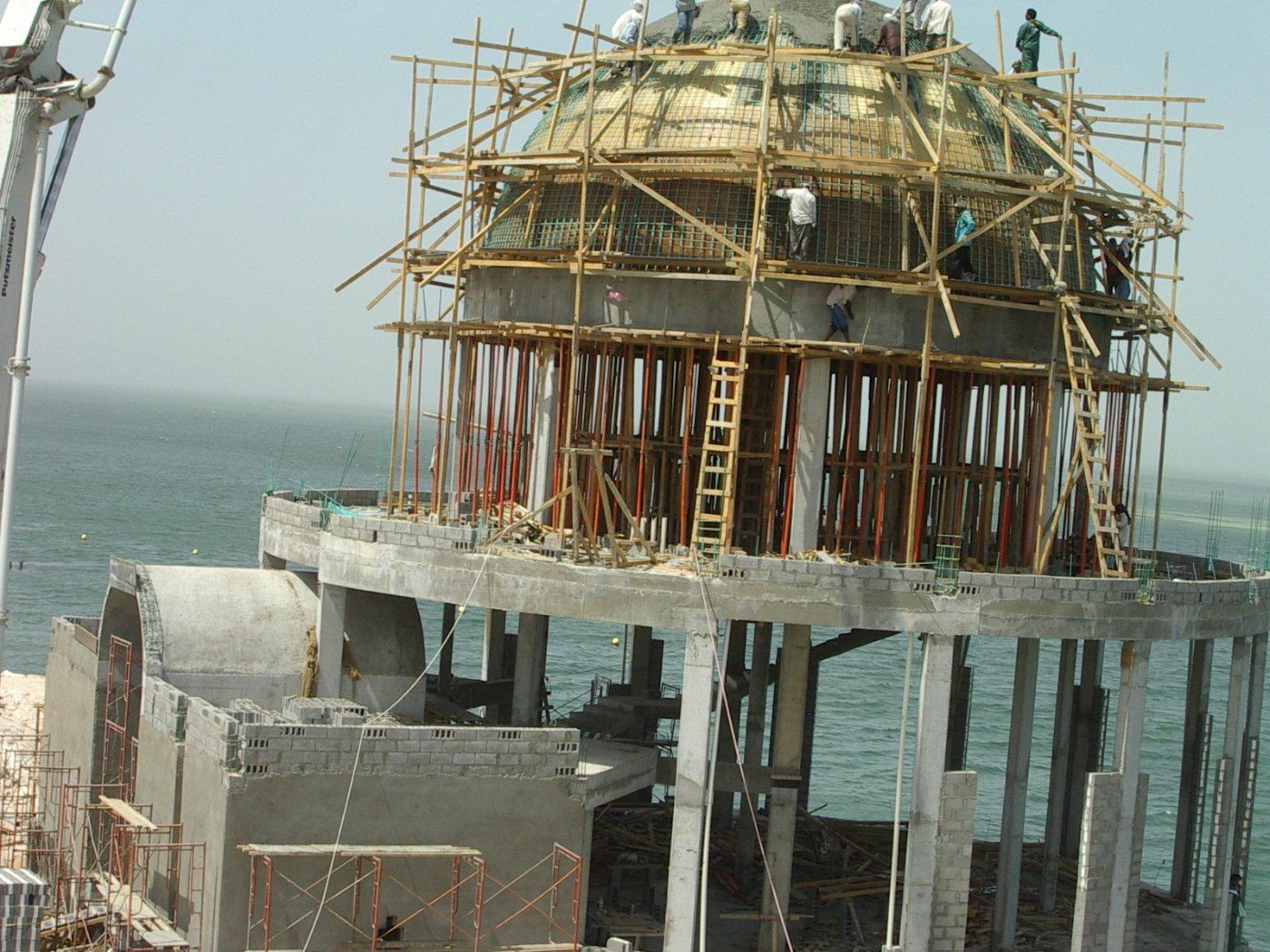 Reinforced concrete dome under construction on a coastal site